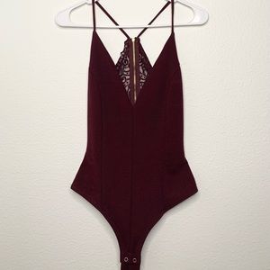 Open laced back burgundy bodysuit